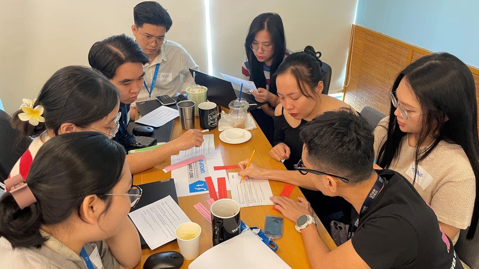 Small-group workshop discussion during the Trust & Compliance program